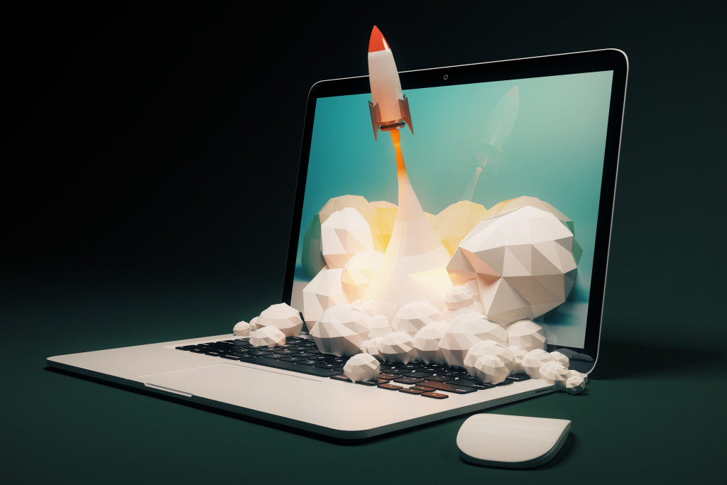 A rocket flying out of a laptop, representing the use of technology to make your business soar